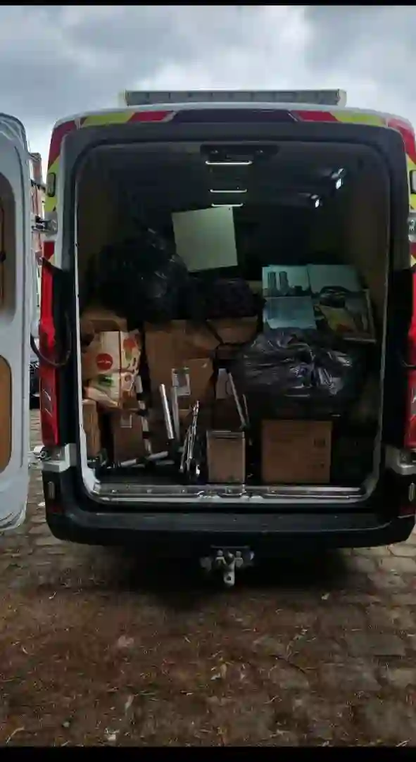 Van loaded with boxes, bags and furniture for a house move